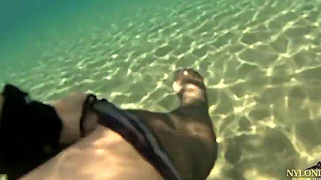 Bodysuit and stockings tease under the sea