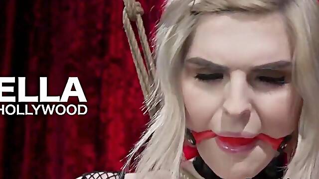 Kinky shemale in fishnet lingerie tied up for BDSM play
