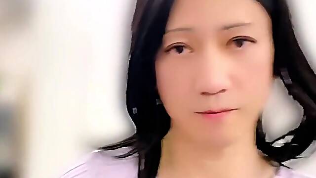 Spectacular Asian crossdresser poses bare in the office