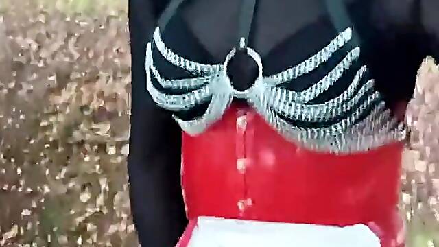 Sissy bitch in red outfit and haunch high boots by the side of the road