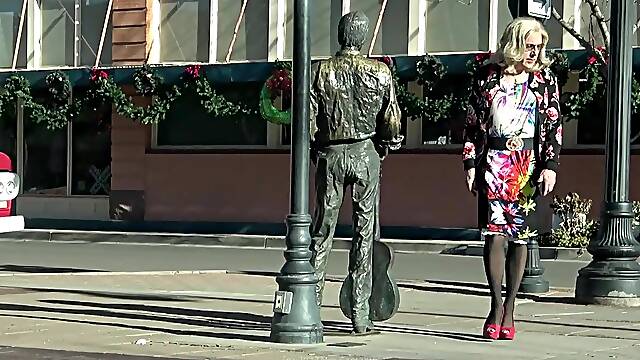 Mrs Samantha 'standing on the corner in Winslow Arizona' and driving her red Mustang Convertible