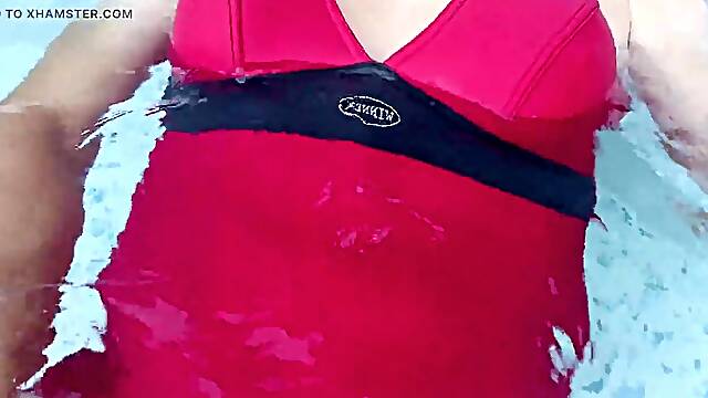 Shemale in hawt one piece swimsuit jerking in swimming pool