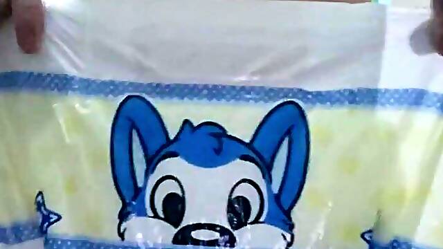 Pissing on an open diaper then puting it on