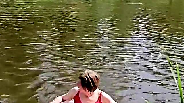 Annemieke gets wet in pink costume and sneakers