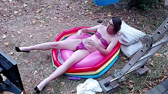 Outdoor WAM sissy gurl in pinkish pvc micro swimsuit lubricated up and drenched in milky water plays with herself no cum