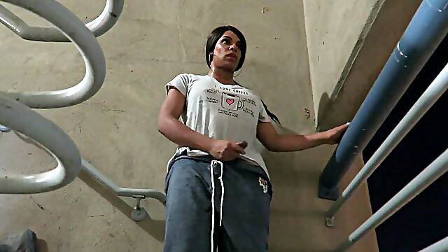 Wanking her humungous cock and busting a nads in a parking garage
