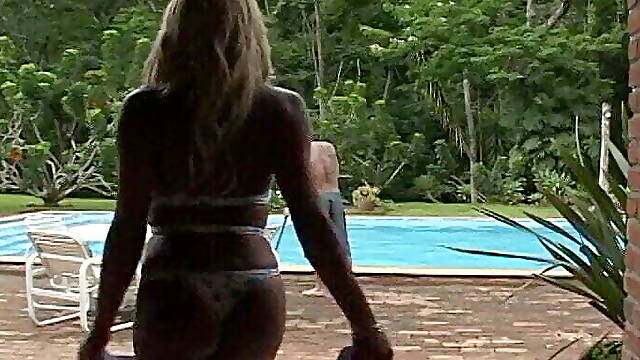 Impressive blonde tranny fucks a dude by the pool aftre blowjob