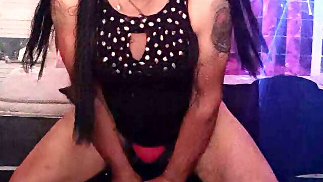 Crossdresser fucking a dildo