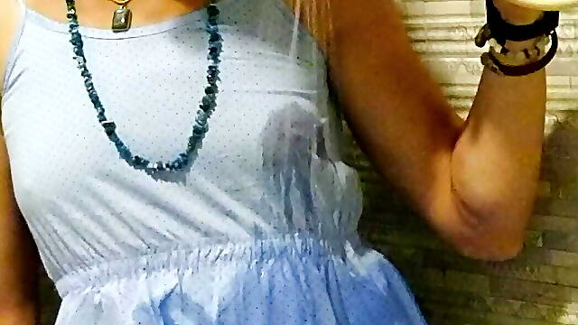 Transgirl wetlook in light-blue summer dress in the shower.