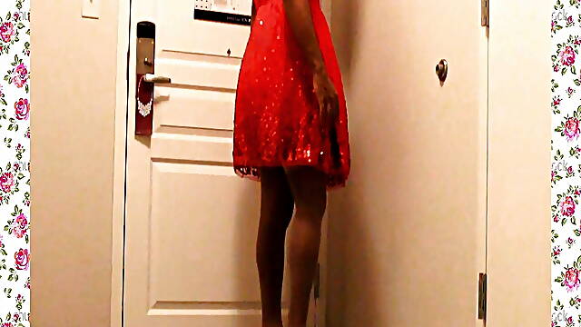 A 1950s SISSY DANCE FOR HER HUSBAND WEARING A PARTY DRESS