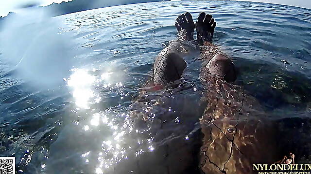 Fishnet stocking in public sea and beach