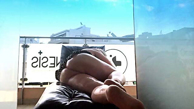 Elena Andreou, a Greek cross, the crazy woman took the small sofa out on the balcony and without a trace of shame put oil on her