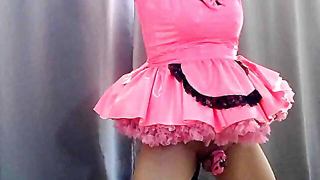 Sissy Maid in Hot Pink Dress and Chastity Is Locked to Her Dildo Stand