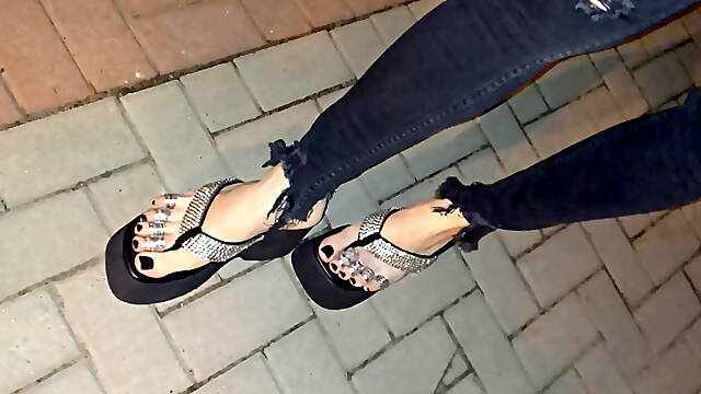 I wear platform flip-flops and tight jeans, showing off my feet.