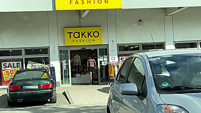 In a super short mini skirt and a thoughtful bodysuit while shopping