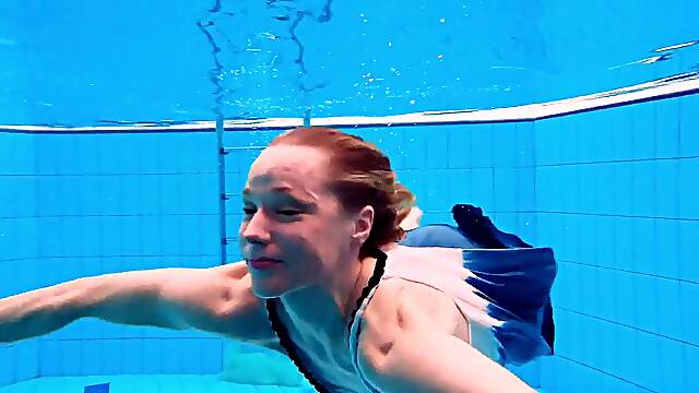 Teen chick Avenna enjoys a refreshing swim in the pool